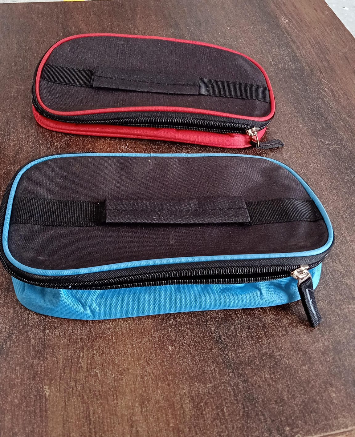 Insulated lunch bag holding a tiffin box securely inside.