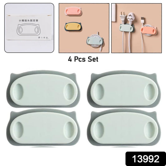 Close-up of pig-shaped cable holder clips organizing wires