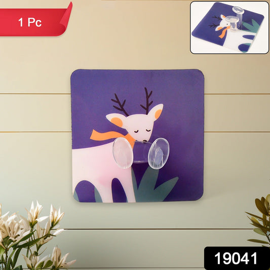 Self-adhesive wall hook with strong grip securely holding keys and small accessories.