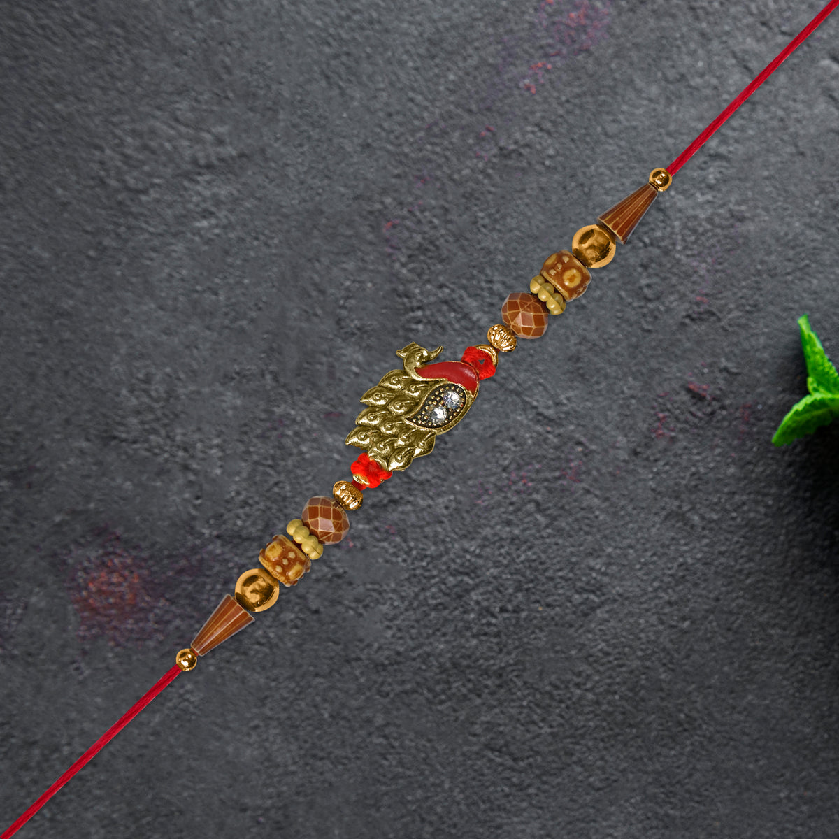 Antique Peacock Feather Rakhi With Beaded Thread