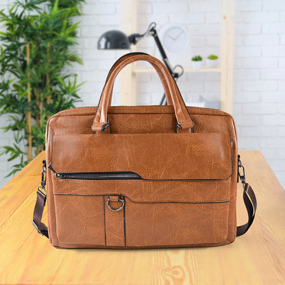 Tan brown faux leather laptop messenger bag with shoulder strap and handles