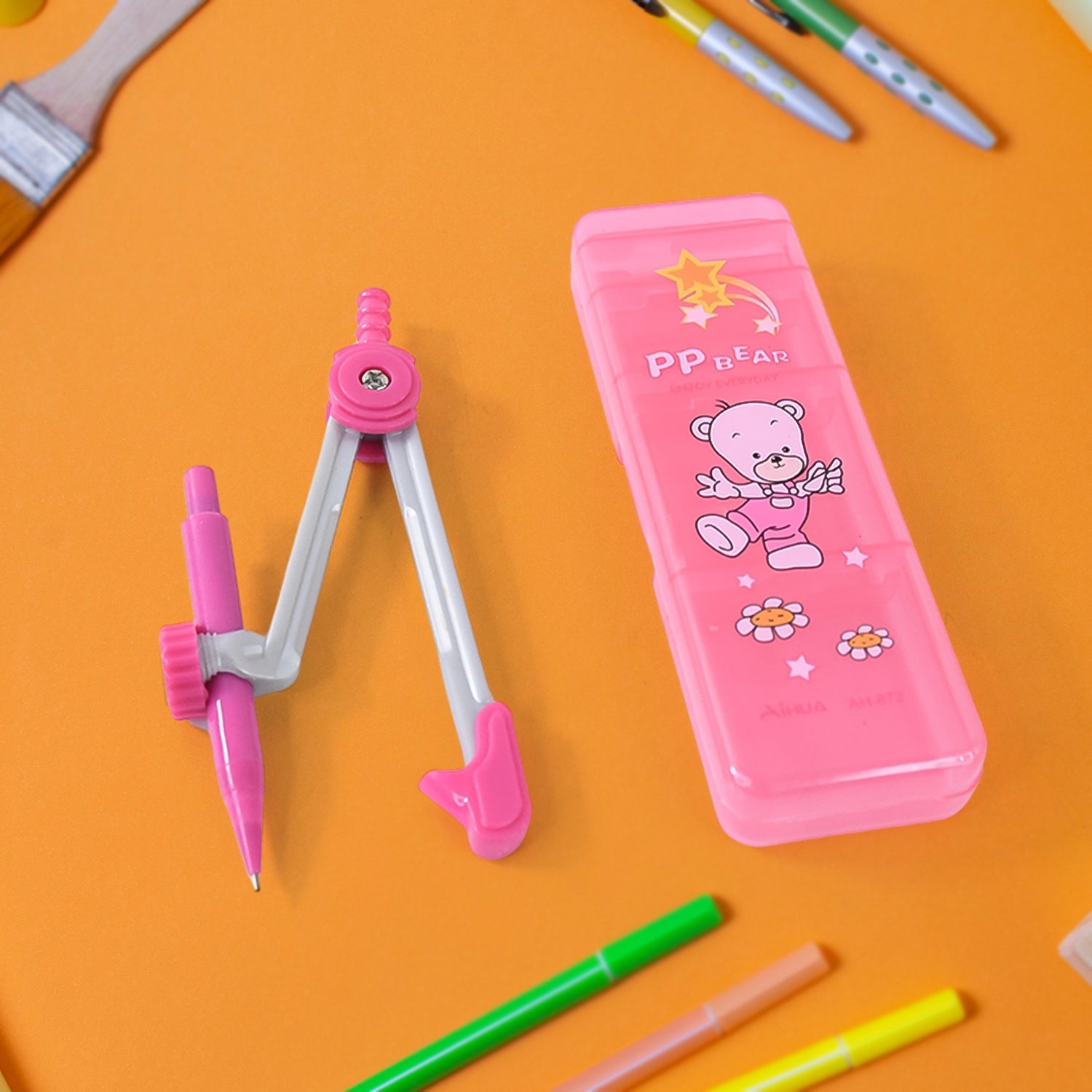 Kids geometry compass set with pink bear-themed storage box