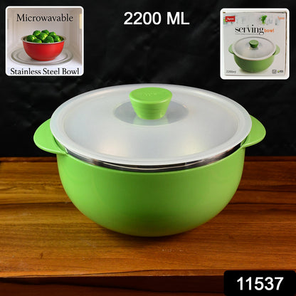 Microwave-safe plastic serving bowl filled with hot food and covered lid