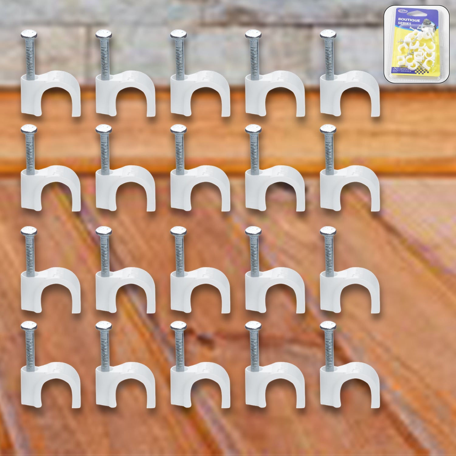 Close-up of steel nail gripping a plastic cable clip for dependable wire holding