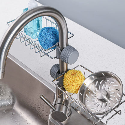 Stainless steel sink caddy organizer holding soap and sponge on kitchen sink