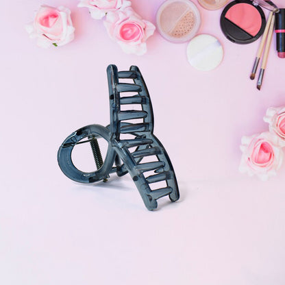 Close-up of matte plastic hair barrette clamp open