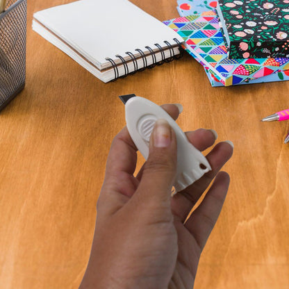 Mini Cloud Box Cutter held in hand for size reference