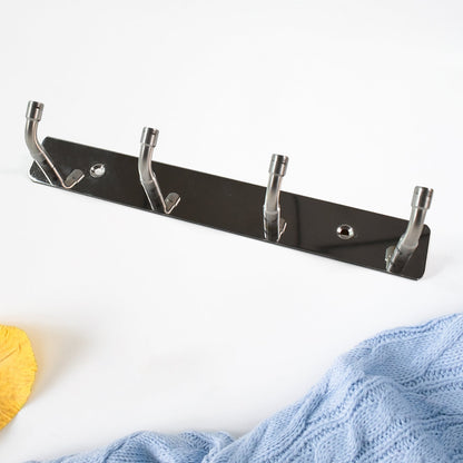 Wall mounted stainless steel hook rack used in entryway for coats and keys