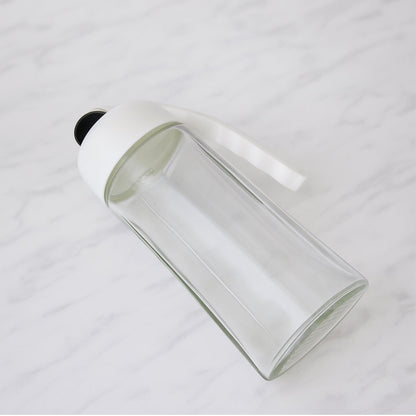 Automatic lid mechanism opening on glass oil bottle dispenser