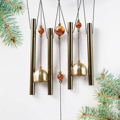 Lord Ganesh Wind Chimes displayed in garden setting creating peaceful ambiance