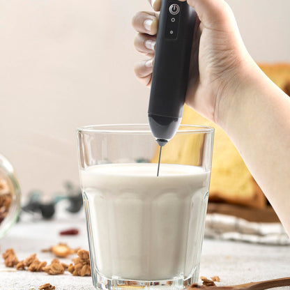 Closeup of stainless steel whisk on electric handheld milk frother