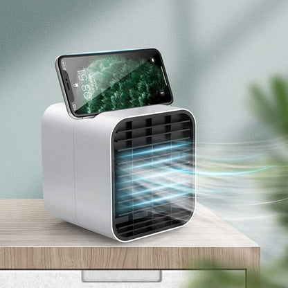 Pink portable mini air cooler fan with water cooling function on desk