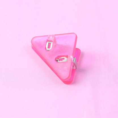 Small triangle paper clip used as corner clip on document