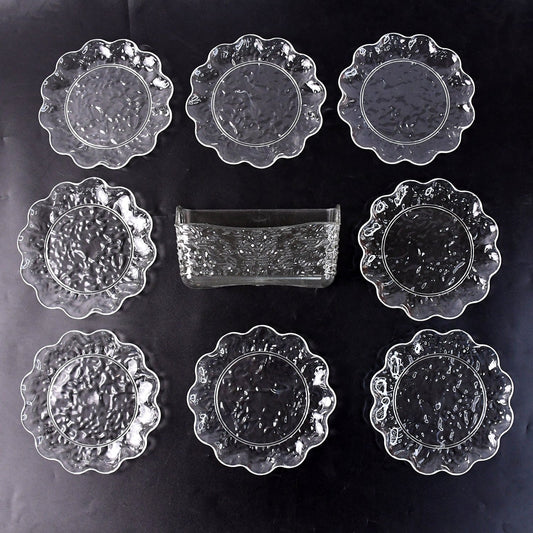 9-piece plastic bowl set with serving tray displaying transparent bowls and plates