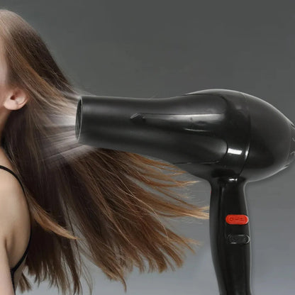 Hair dryer in action, creating a sleek hairstyle for Indian hair.