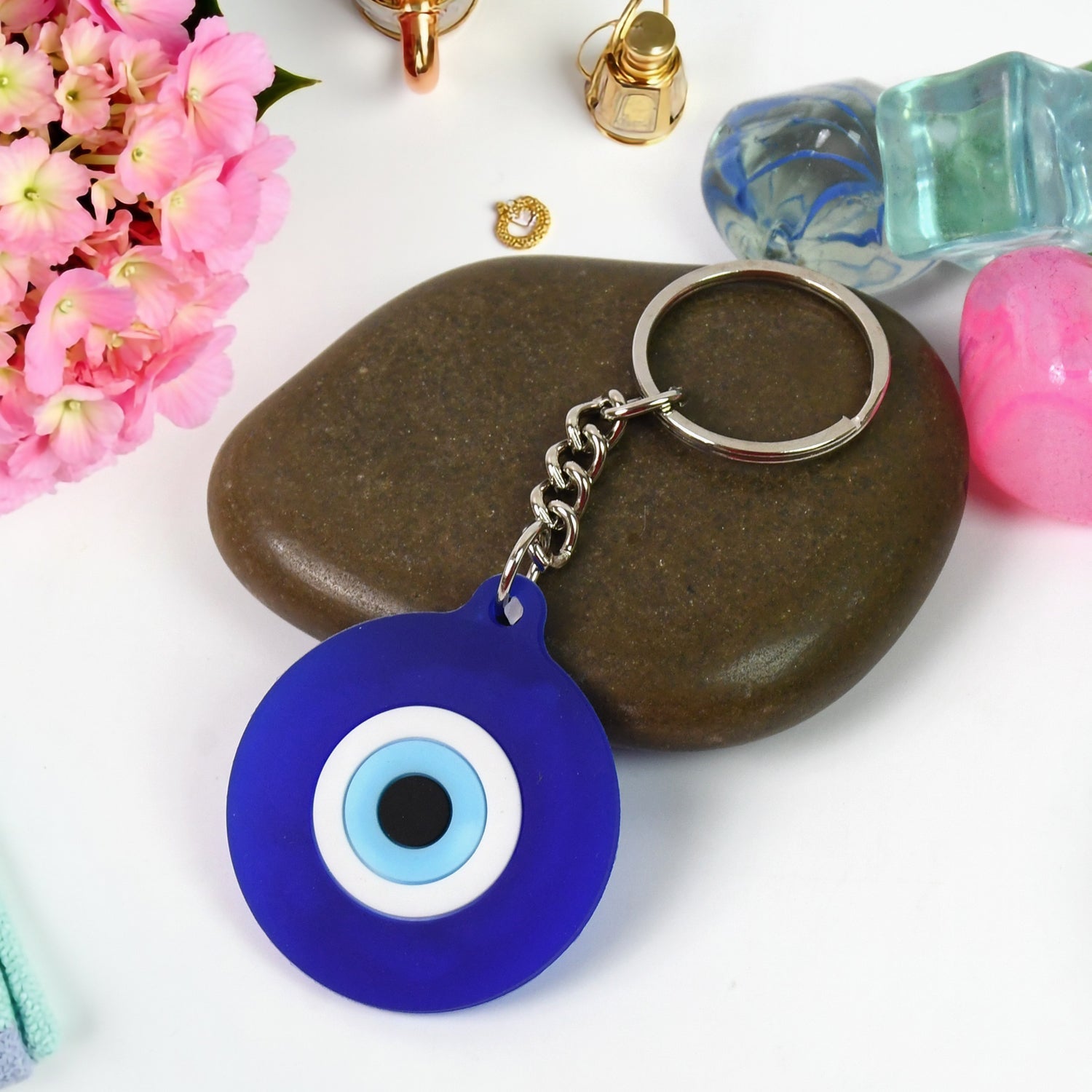 Eye guard key charm in blue silicone with metal ring for car keys