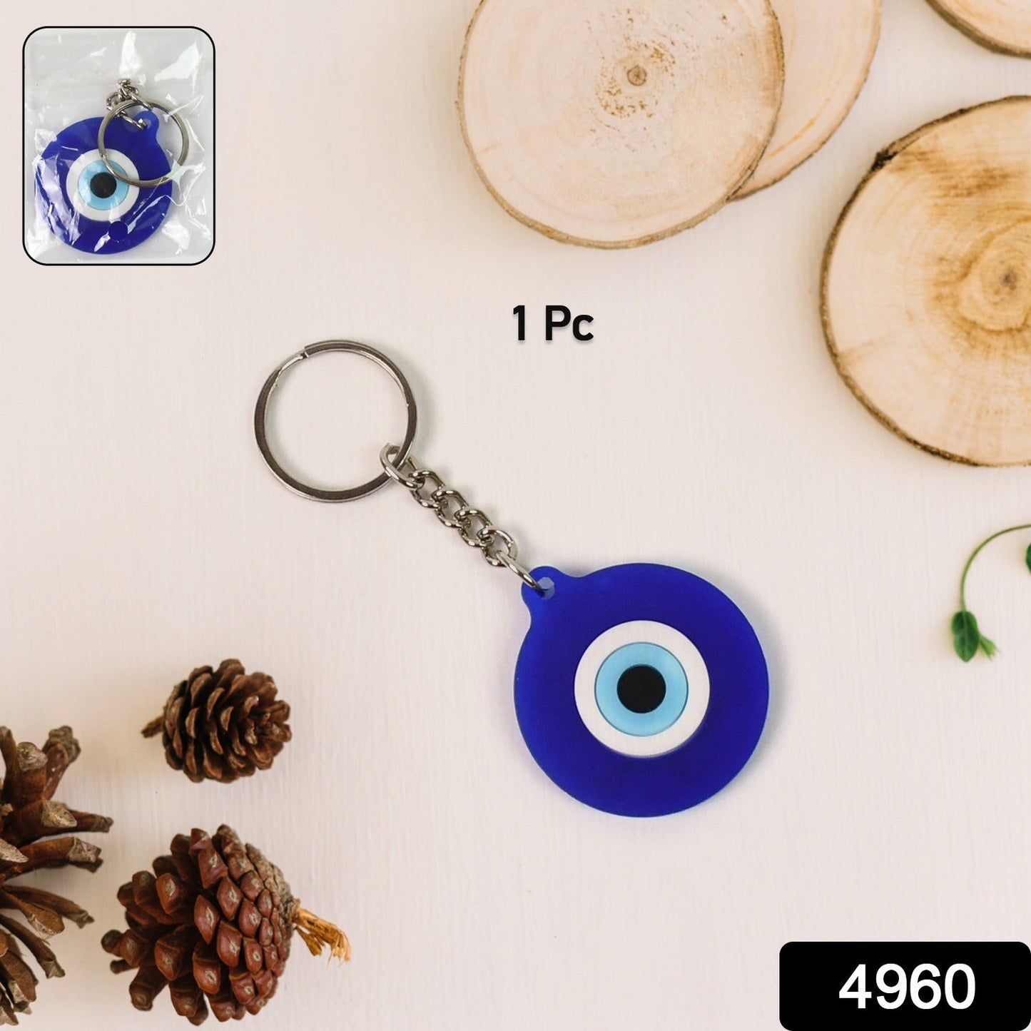 Close-up of Evil Eye silicone keychain in blue color with traditional design