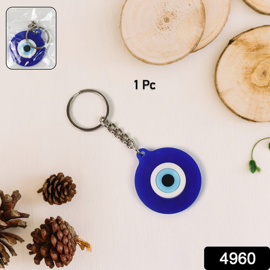 Close-up of Evil Eye silicone keychain in blue color with traditional design
