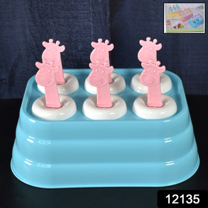 Giraffe ice molds filled with popsicle mixture ready for freezing