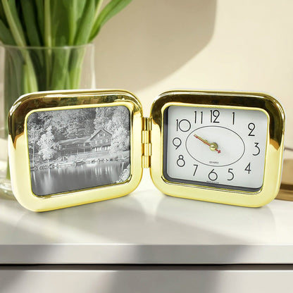 Hand holding compact foldable desk clock for easy portability