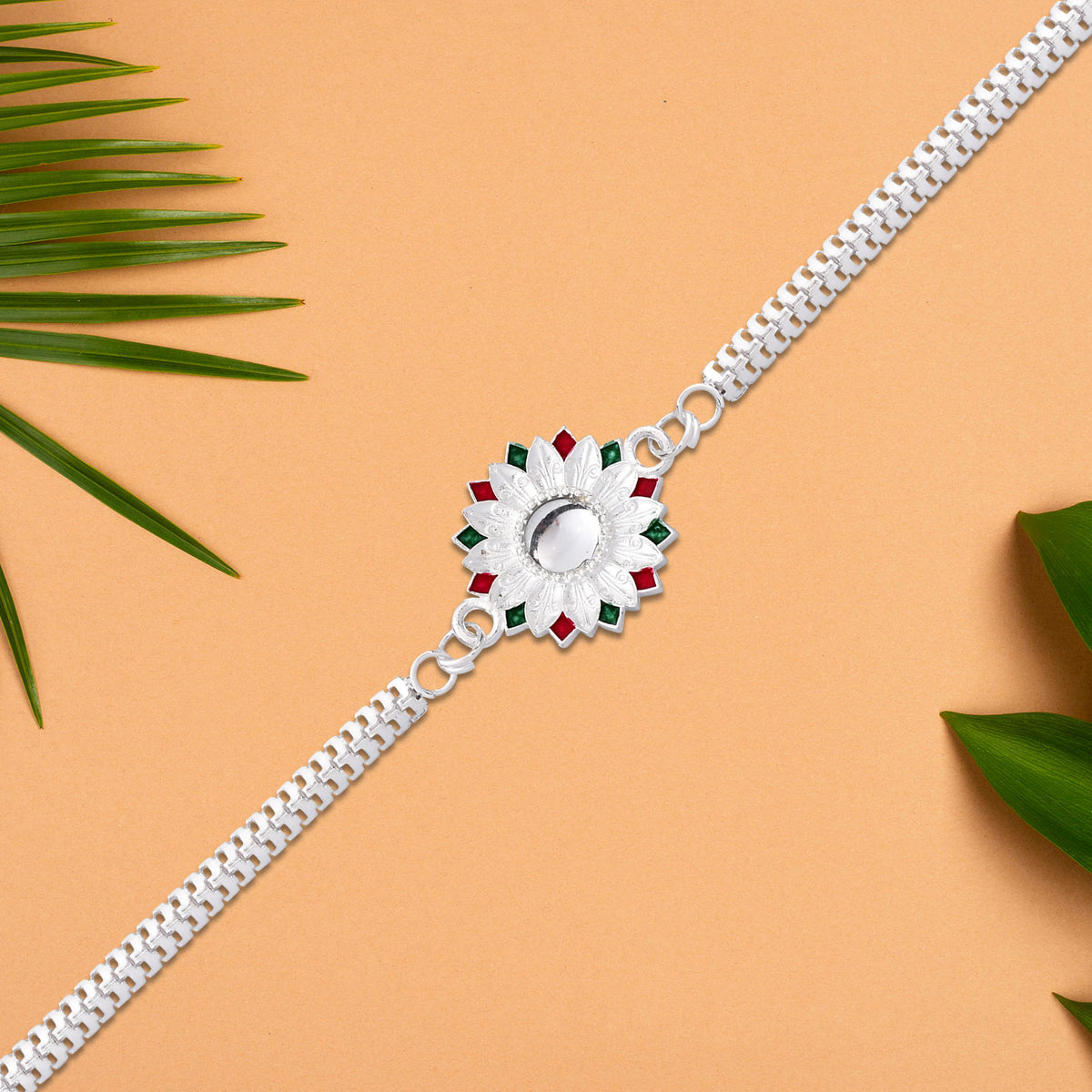 Elegant Silver-plated Floral Rakhi With Red And Green Meenakari Accents