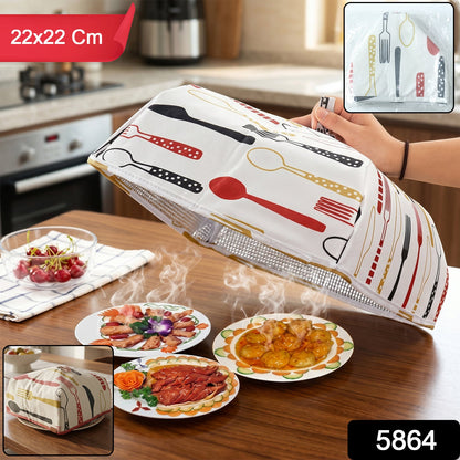 CookAura foldable food cover protecting a plate in the kitchen