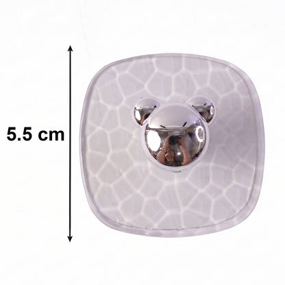 Side view showing clear adhesive wall hook mounted seamlessly on a wall.