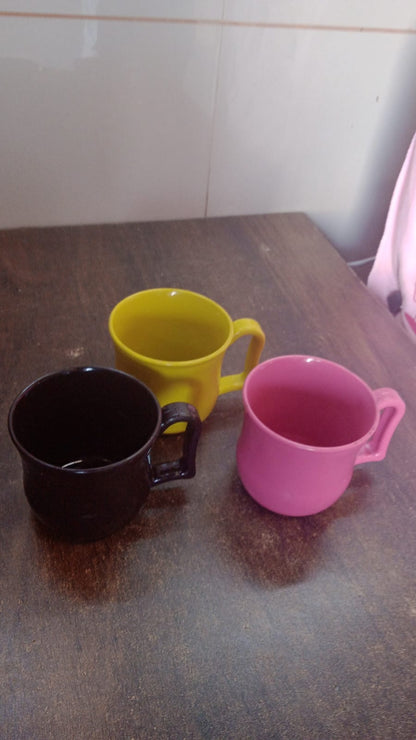 An empty plastic coffee mug ready for use, showcasing its sturdy base and comfortable grip.