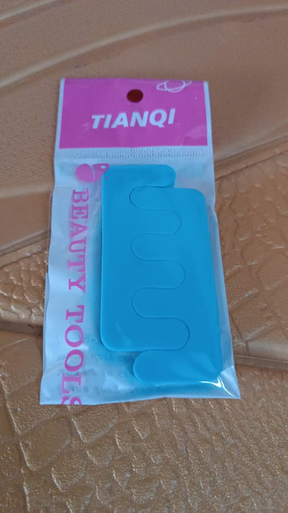 Close up of sponge toe separator used for comfortable toe alignment during pedicure