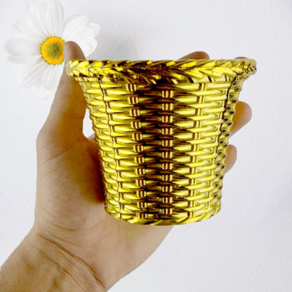 Valencia plastic flower pot shown in outdoor garden setting