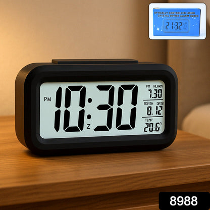 Night view of digital LCD alarm clock with soft glowing backlight
