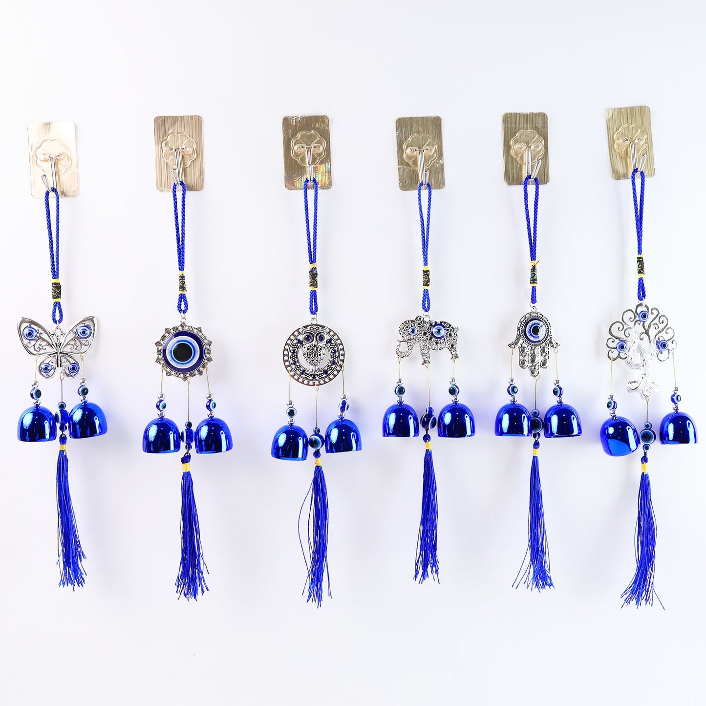 Detailed view of evil eye metal bell wind chime for house protection